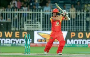  ?? Photo by M. Sajjad ?? Multan Sultans’ players celebrate the fall of an Islamabad United wicket while at right, Luke Ronchi hits a boundary during his knock of 58 in the PSL match on Tuesday. —