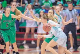  ?? EDDIE MOORE/ JOURNAL ?? Moriarty’s Alyssa Adams drives past Pojoaque Valley’s Dallas Archibald while other defenders await during Thursday’s Class 4A semifinal. Moriarty won 47-38 and faces Portales in today’s final.