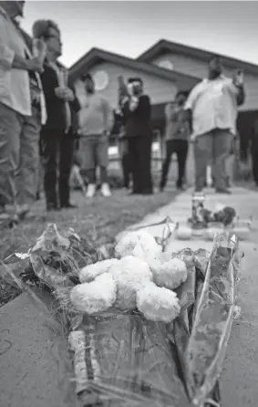  ?? SMILEY N. POOL/THE DALLAS MORNING NEWS VIA AP ?? Protesters leave flowers during a community vigil for Atatiana Jefferson on Oct. 13, 2019, in Fort Worth, Texas. She was fatally shot by a police officer in her home. The officer was charged with murder.