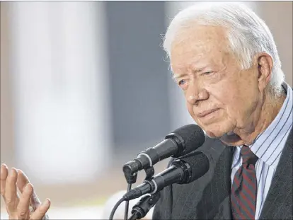  ?? DAVIS TURNER / GETTY IMAGES ?? Former President Jimmy Carter’s peace-brokering resume includes a 1979 treaty between Egypt and Israel and agreements between the U.S. and Russia over arms control. “I am honored to be working with the King family in an effort to resolve the...