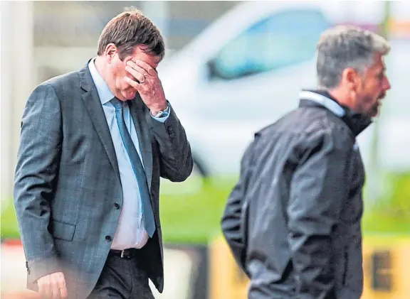  ??  ?? Above: St Johnstone boss Tommy Wright looks a bit perplexed at full-time after his side were beaten at home by Motherwell. Opposite page, clockwise from top: Morton’s Reece Lyon tracking Dundee United’s Adrian Sporle, Dundee forward Danny Johnson at full-time after the 1-1 draw with Queen of the South at Palmerston Park, and Arbroath manager Dick Campbell.