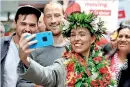  ??  ?? Jacinda Ardern takes pictures with supporters. (REUTERS/File)