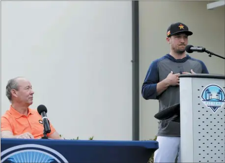  ?? JEFF ROBERSON — THE ASSOCIATED PRESS ?? Houston’s Alex Bregman, right, delivers a statement as Astros owner Jim Crane listens during a news conference before the start of the first official practice for the team on Thursday in West Palm Beach, Fla.