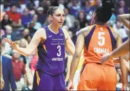  ?? Sean D. Elliot / Associated Press ?? Connecticu­t Sun guard Jasmine Thomas (5) confronts Phoenix Mercury guard Diana Taurasi after being fouled during the first half of a singleelim­ination WNBA playoff game Aug. 23, 2018, at Mohegan Sun Arena.