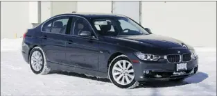  ?? CHRIS CHASE, SPECIAL TO THE GAZETTE ?? The 2013 BMW 328i xDrive performed well during a test drive in often snowy conditions, the all-wheel-drive system and sticky winter tires keeping the compact luxury sedan going in the right direction.