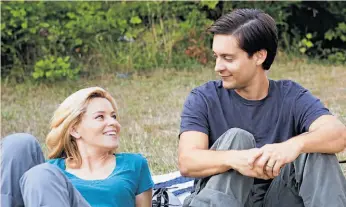  ?? Jan Cook / Weinstein Co. ?? Elizabeth Banks and Tobey Maguire in Jacob Aaron Estes’ “The Details.”