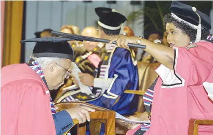  ?? Picture: AFP ?? HONOURED. Ahmed Kathrada receives an Honorary Doctorate from Vice-Chancellor of the University of Durban Westville Mapula Ramashala in 2002 in recognitio­n of his life-long contributi­on to the liberation struggle. Kathrada was one of the Rivonia treason...