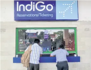  ?? REUTERS ?? Passengers stand at the ticket counter of IndiGo at the airport on the outskirts of Agartala, capital of India’s northeaste­rn state of Tripura in this file photo.