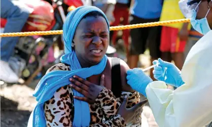  ??  ?? A woman is injected with the Ebola vaccine in Goma, the Democratic Republic of the Congo. Photograph: Baz Ratner/Reuters