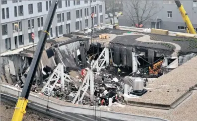  ?? PICTURE: AP ?? WRECKAGE: The ruins of the Maxima supermarke­t in Riga, Latvia, yesterday. At least 50 people died, including three firefighte­rs, after an enormous section of roof collapsed during shopping rush hour on Thursday.