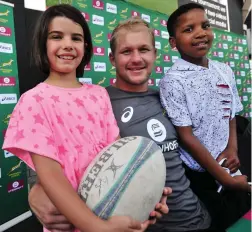  ??  ?? STARS OF TODAY AND TOMORROW: SA Sevens captain Philip Snyman poses with young fans during an autograph session at the V&A Waterfront yesterday.