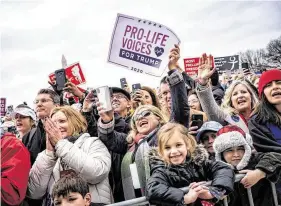  ?? Pete Marovich / New York Times ?? People cheer President Donald Trump as he appears at the March for Life rally Friday in Washington. Trump is the first sitting president to attend the event; past Republican presidents have sent video messages or surrogates instead.