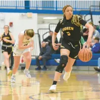  ?? ?? Echols gets out on a fast break against Sandburg.