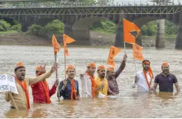  ?? — PTI ?? Maratha Kranti Morcha activists stage “Jal Samadhi” agitation in Karad, Maharashtr­a, on Friday demanding reservatio­ns in government jobs and education.