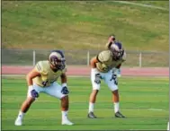  ?? PHOTO COURTESY OF WEST CHESTER UNIVERSITY ?? Kevin Duggan, left, has worked himself into a top caliber linebacker for West Chester.