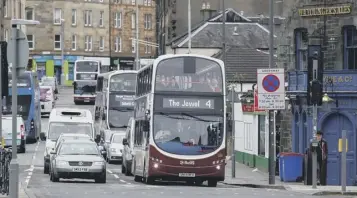  ??  ?? 0 Council-owned Lothian Buses has been seen as a ‘cash cow’ for the local authority