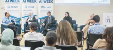  ?? ?? ↑ A panel discussion under way during AI Week at the American University of Sharjah.