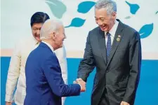  ?? Vincent Thian/Associated Press ?? President Joe Biden greets Singapore Prime Minister Lee Hsien Loong during the ASEAN summit Saturday in Cambodia.