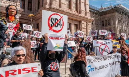  ?? Photograph: Brandon Bell/Getty Images ?? People protest against Senate Bill 4 during a rally at the Texas state capitol in Austin, on 9 March.