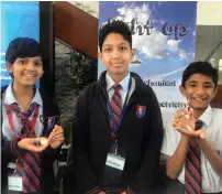  ??  ?? Kavya Subramania­n, Mohammed Abdus Samad Khan and Salmaan Akhtar pose for a photograph with their ‘Light Up’ device.