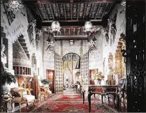  ?? PALM BEACH DAILY NEWS ?? Mar-a-Lago’s entrance hall features centuries-old Spanish tile on the walls. The dominant feature is a hooded fireplace with 16th century Roman busts.