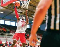  ?? NEW MEXICAN FILE PHOTO ?? Lobos coach Paul Weir stopped short of saying Sam Logwood, above during the Cherry & Silver Game in October, is back in good graces after returning to practice Wedesday after leaving the team Dec. 8. He also didn’t say if the 6-foot-8 senior would ever...