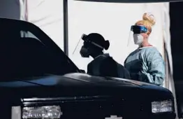  ?? JOHN LOCHER/AP ?? Health care workers test patients July 10 at a drive-thru COVID-19 testing site in Las Vegas. Nevada became one of the last states to report rapid antigen tests.