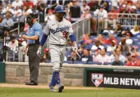  ?? Mitchell Layton / Getty Images ?? The Dodgers’ Mookie Betts heads back to the dugout after striking out in the eighth inning. NL West-leading Los Angeles was shut out for the first time this season.