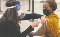  ?? JASON FRANSON/ THE CANADIAN PRESS FILES ?? The province completed only half of its planned vaccinatio­ns by the end of 2020, but Premier Jason Kenney said it is now on pace to hit 4,000 vaccinatio­ns a day.