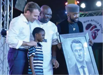  ??  ?? President Macron (left), Gov. Ambode, Banky W and 11-year-old Kareem Waris Olamilekan, a young Nigerian artist who made Macron’s portrait