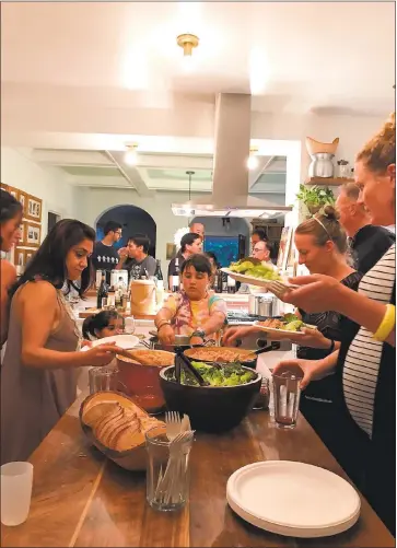  ?? DENISE WOODWARD ?? It’s a family-style buffet at Pasta Friday, the weekly dinner night started by Allison Arevalo, the former chef and coowner of Homeroom restaurant in Oakland.