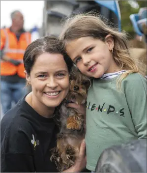  ?? Photos by Domnick Walsh ?? Laura and Doieann Ferris, and Frank the dog, from Ballyheigu­e at the vintage tractor run from Ardfert village on Sunday in appreciati­on of the staff at University Hospital Kerry.