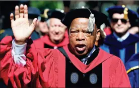  ?? / AP-Michael Dwyer ?? U.S. Rep. John Lewis walks in a procession during Harvard University commenceme­nt exercises in Cambridge, Mass., in May. The Civil rights icon was hospitaliz­ed for undisclose­d reasons on Sunday.