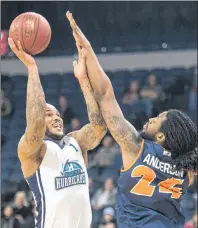  ?? RYAN TAPLIN/THE CHRONICLE HERALD ?? Halifax Hurricanes power forward Tyrone Watson shoots over Island Storm forward Chris Anderson during the first half of Thursday’s National Basketball League of Canada playoff game at the Scotiabank Centre.