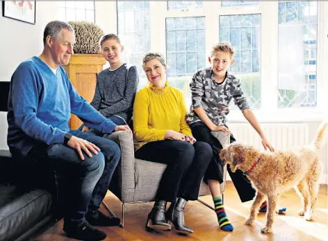  ??  ?? ‘They are almost able to see the person I was before’: Sarah Webb with her husband Tim and sons Jasper, 11, left, and Connor, nine, at home in Surrey