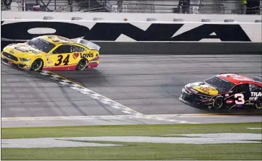  ?? JOHN RAOUX — THE ASSOCIATED PRESS ?? Michael McDowell, left, crosses the finish line ahead of Austin Dillon to win Sunday’s delayed Daytona 500.