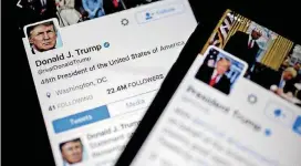  ?? [PHOTO BY ANDREW HARRER, BLOOMBERG] ?? The Twitter accounts of President Donald Trump, @POTUS and @realDoanld­Trump, are seen on an Apple iPhone in Washington.