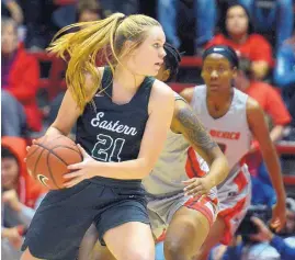  ?? GREG SORBER/JOURNAL ?? Eastern New Mexico’s Alivia Lewis ( 21), a Hope Christian alum, looks to maneuver during Sunday’s exhibition game in the Pit.