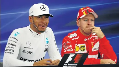  ?? /Reuters ?? Leaders of the pack: Briton Lewis Hamilton, left, and Sebastian Vettel from Germany are front-runners for the world title with Hamilton odds-on favourite to triumph.