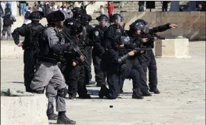  ?? AP/MAHMOUD ILLEAN ?? Israeli police gather at the Al-Aqsa Mosque compound in Jerusalem, the site of Sunday’s clashes.