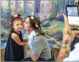  ?? ?? Nicole and Charlie Hall pose for a picture during a belated Mother’s Day celebratio­n inside The Mission at Kern County on Saturday.