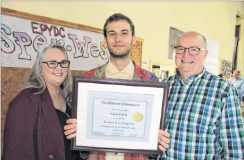  ?? COLIN MACLEAN/JOURNAL PIONEER ?? Nolan Peters, centre, graduated from the Prosper West program of the East Prince Youth Developmen­t Centre in September. Presenting Peters with his diploma was Joyce Newcombe, left, program co-ordinator, and Ken Culleton, program facilitato­r.