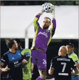  ?? EMILEE CHINN — GETTY IMAGES ?? Seattle Sounder goalkeeper Stefan Frei leaps up to catch a corner kick during Friday’s game against the Earthquake­s in the MLS Is Back Tournament.