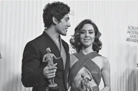  ?? FREDERIC J. BROWN/GETTY IMAGES ?? Aubrey Plaza and Will Sharpe pose with the award for Outstandin­g Performanc­e by an Ensemble in a Drama Series with the cast of “The White Lotus” during the Screen Actors Guild Awards on Feb. 26 in Century City, Calif. Plaza is also nominated for an Emmy Award for the series.