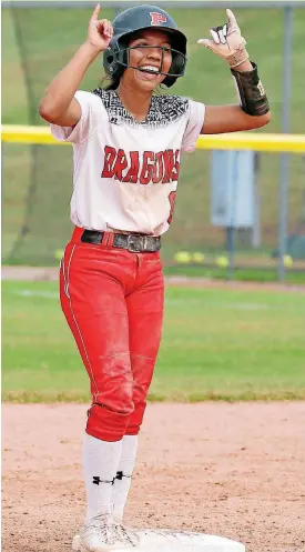  ?? [PHOTO BY STEVE SISNEY, ?? Chelsea Spain of Purcell gestures to teammates after hitting a double during Friday’s Class 3A state semifinal against Washington at Hall of Fame Stadium.