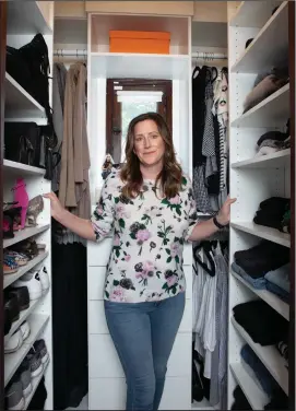  ?? Photo for The Washington Post by Douglas Hill ?? Organizer Julie Naylon stands in the bedroom closet of her Los Angeles home.