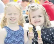  ??  ?? Keeping cool Cousins Lacey Watson (4) and Abigail Kirkland (5) were fans of the ice-cream stall
260615newt­on_03