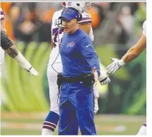  ?? MICHAEL REAVES/GETTY IMAGES FILES ?? Buffalo head coach Sean Mcdermott, centre, has led the Bills to their first two playoff berths of the century.