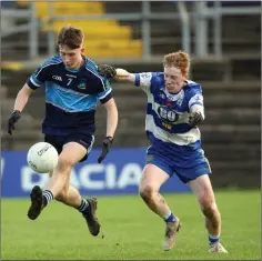  ??  ?? An Tochar’s Gavin Fogarty looks to escape the attentions of Brian Bohan from Blessingto­n during the JAFC final.