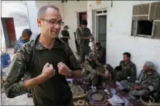  ?? HUSSEIN MALLA - THE ASSOCIATED PRESS ?? In this Monday photo, Macer Gifford, a 30-year former City broker in London, who fights with an Assyrian militia, that is part of the U.S-backed forces battling Islamic State group militants, gives an interview to The Associated Press, on the western...